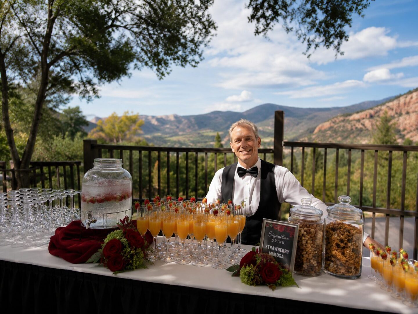Bartender serving drinks with mountain backdrop