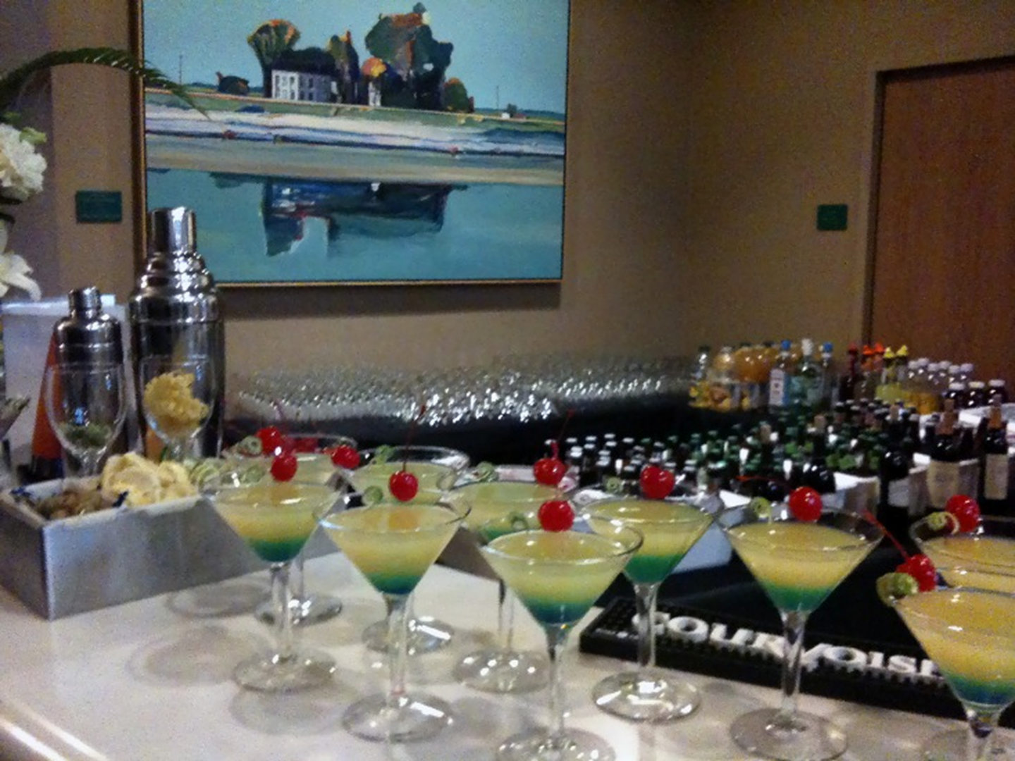 Cocktails and drinks on a bar counter.