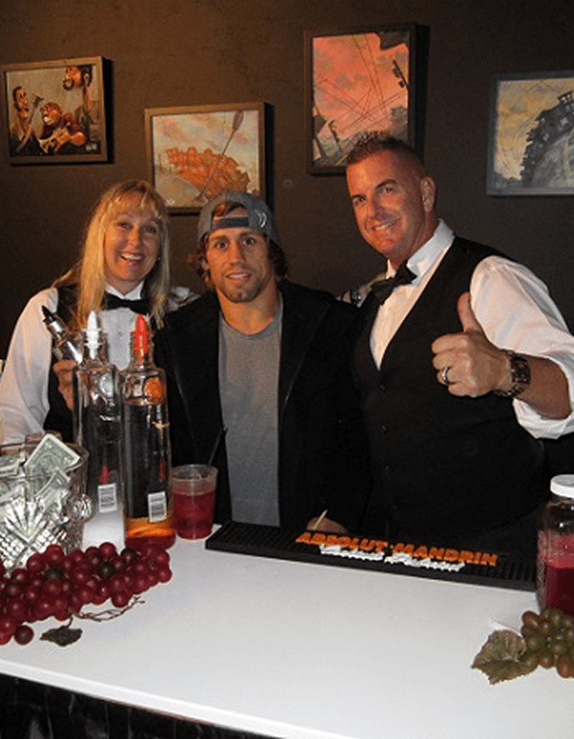 Group photo at a bar counter